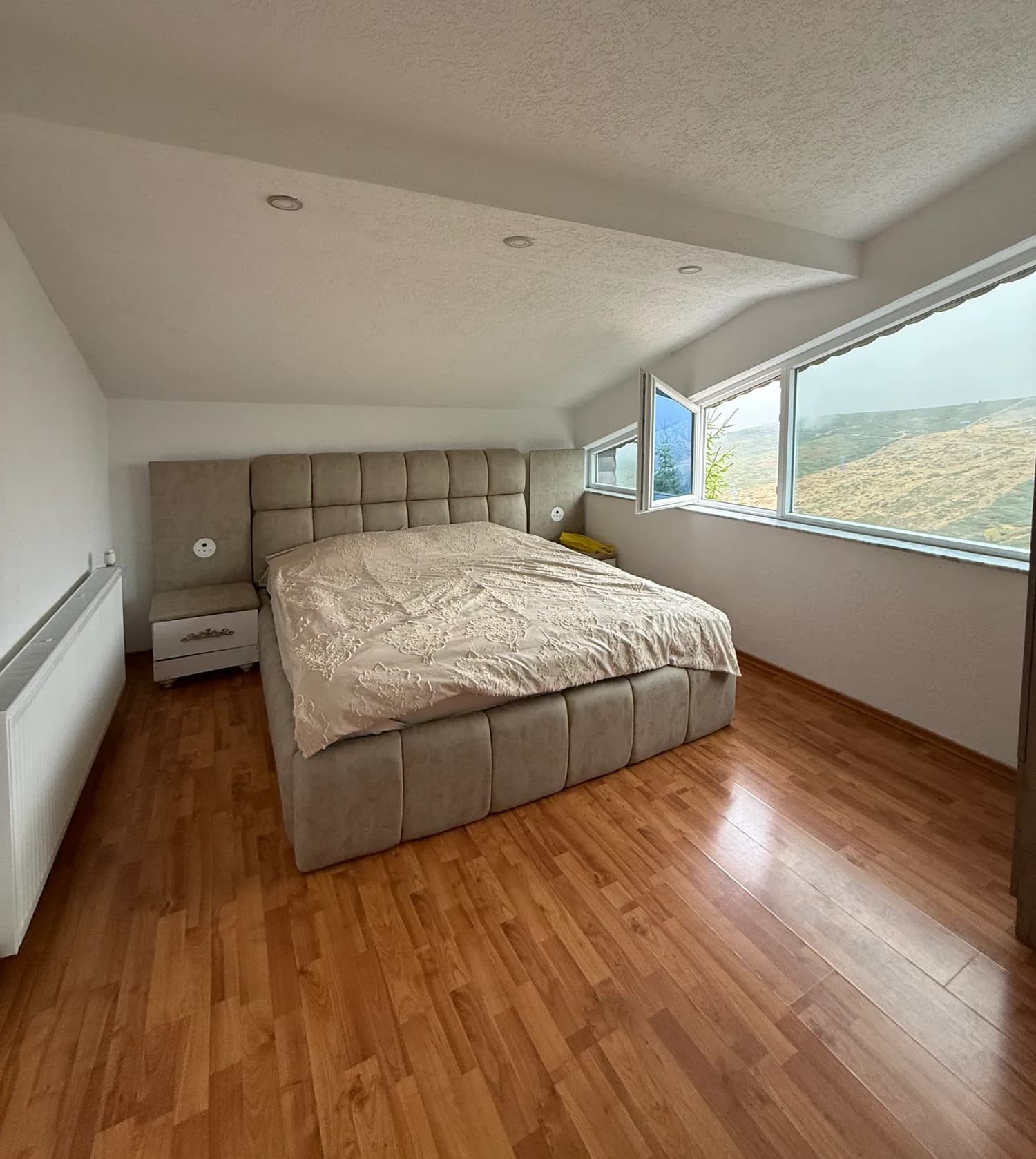 A double bedroom beneath the sloped roof at Villa Noar II